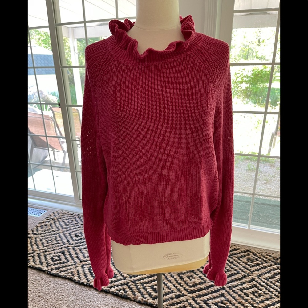 Pink sweater with feminine detail